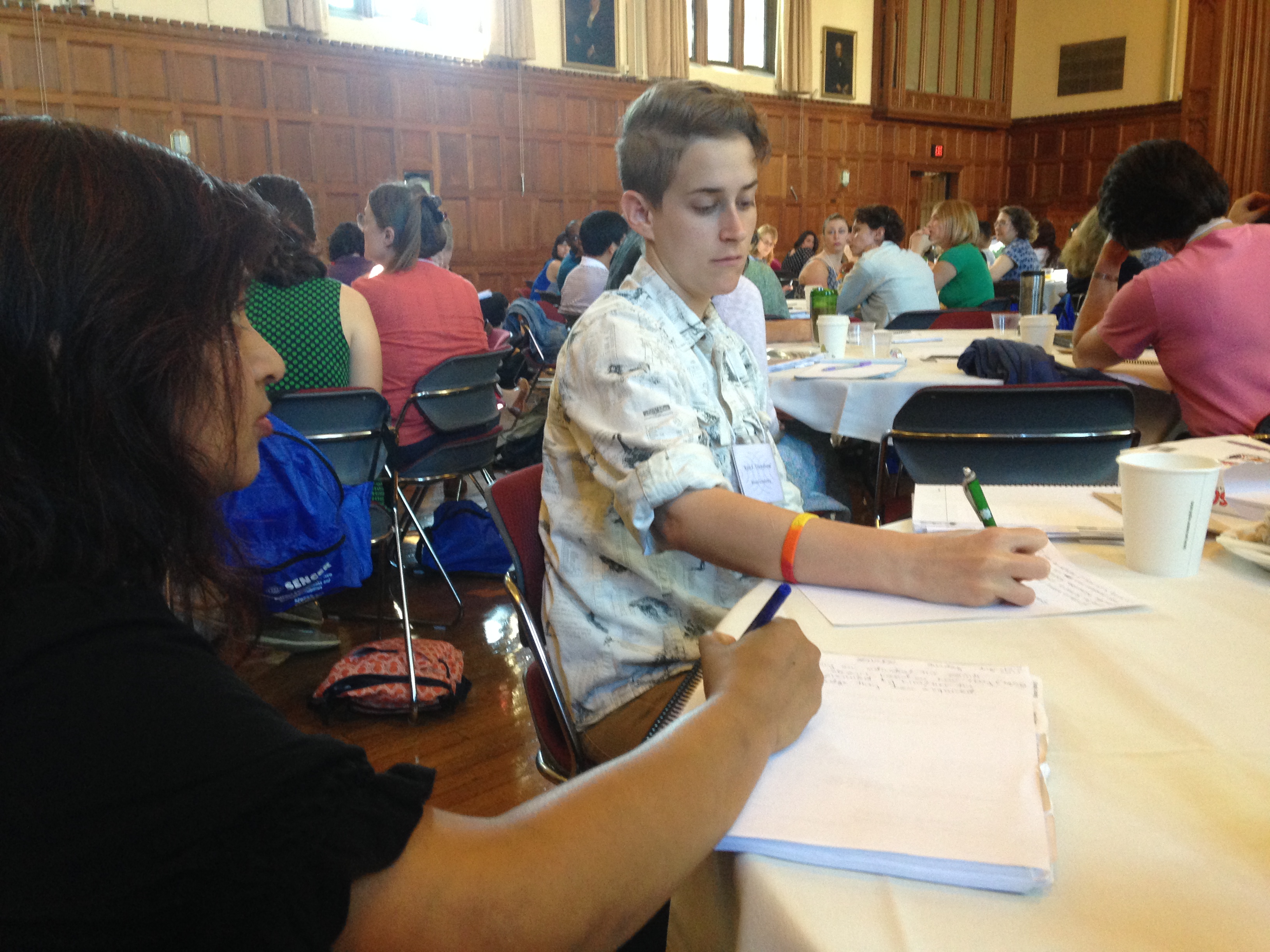 SSI 2015 participants take notes during plenary address.